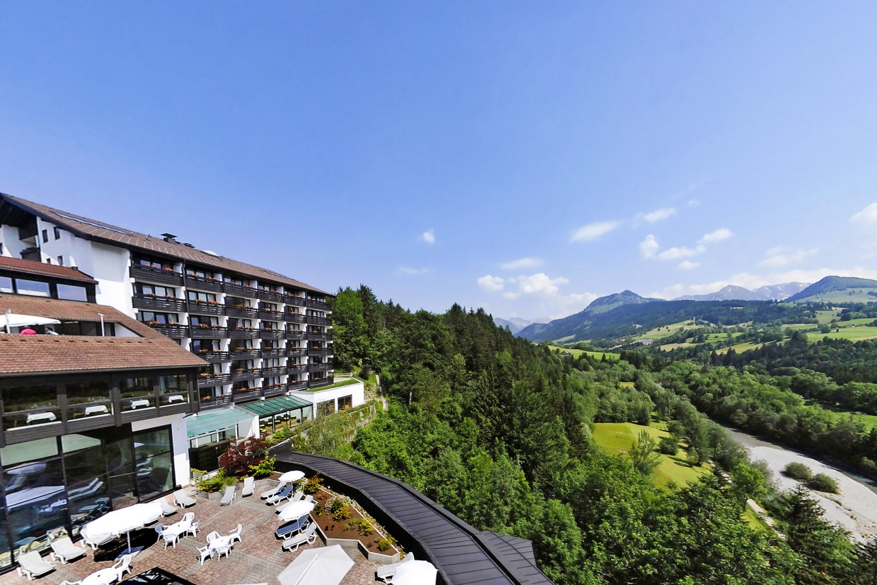 Panorama View of Hotel Allgäu Stern Sonthofen with Fields and Alps in the Background