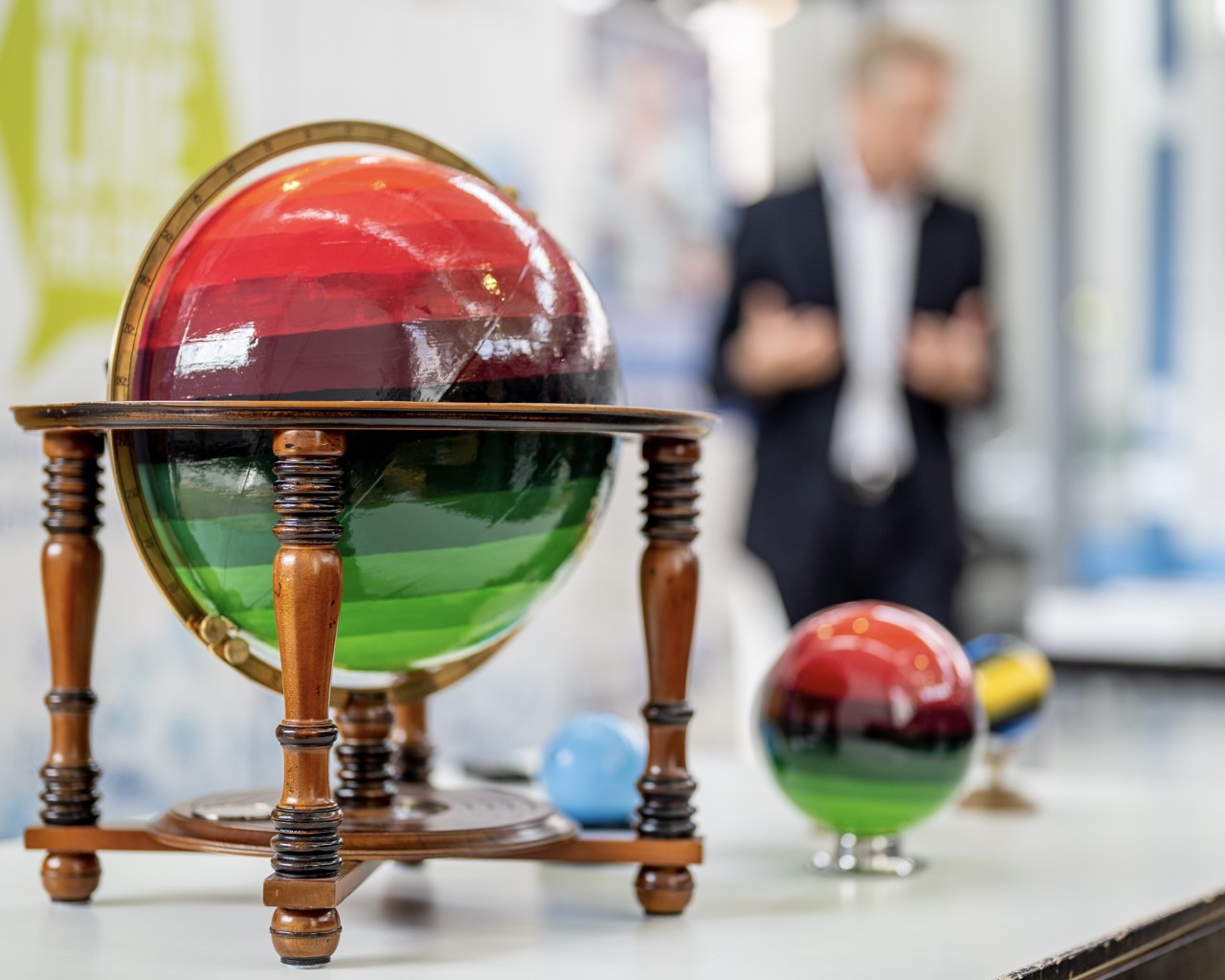 Globes painted in green and red gradient. 